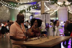 New Orleans Food and Wine Experience attendees sipping wine