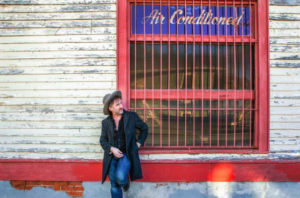 Jon Cleary ourside of bar